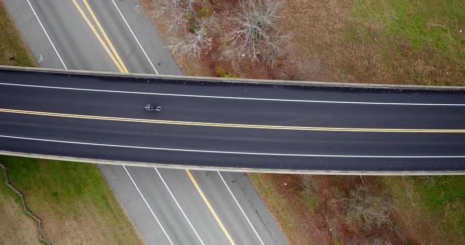 A vehicle travels on a overpass road