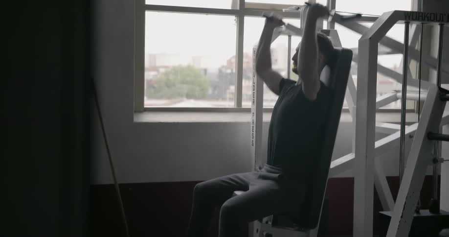 A man is exercising in the gym