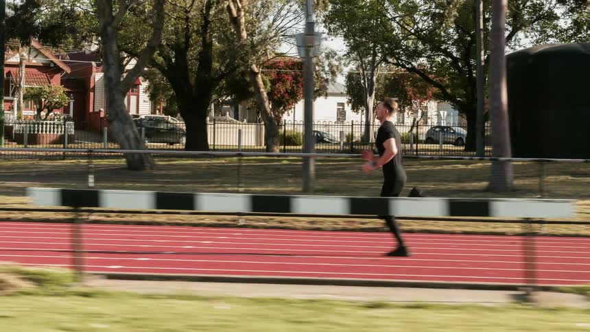 A man runs on the truck on a sunny day