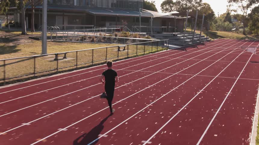 A man runs on a running track
