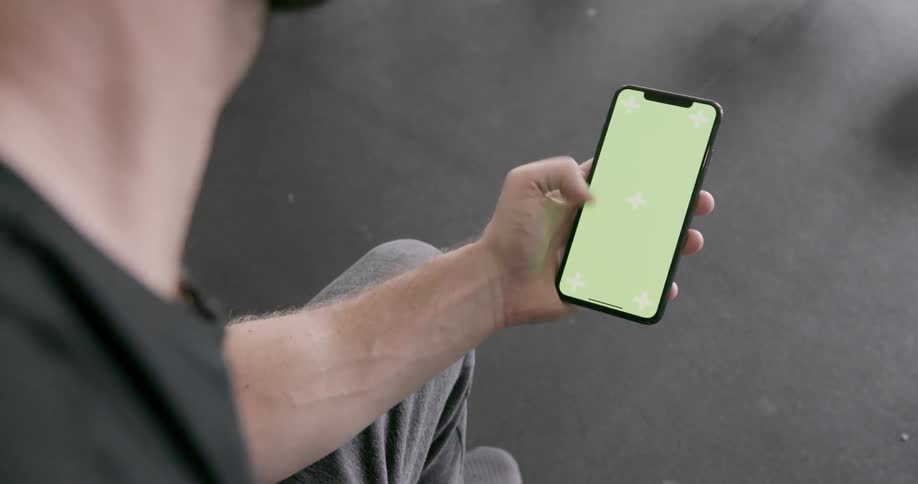 A man looks at his phone