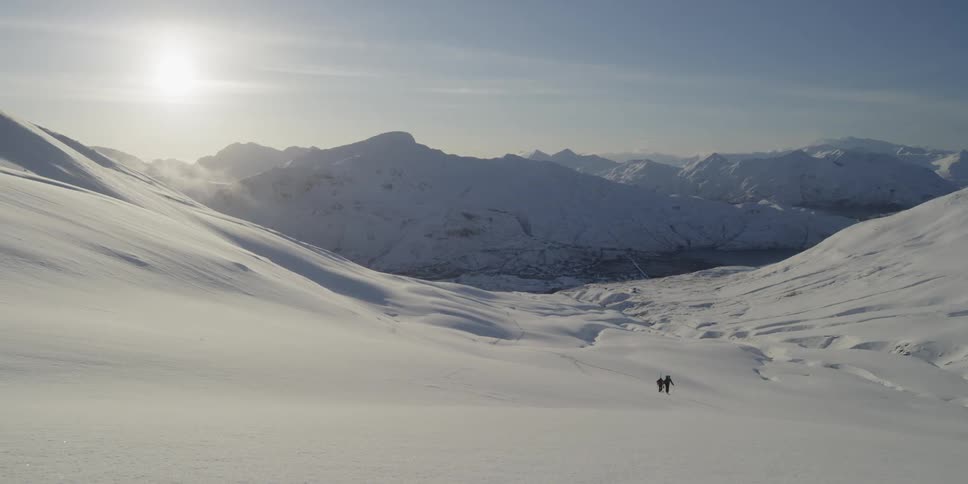 People walk on a beautiful snowy slope