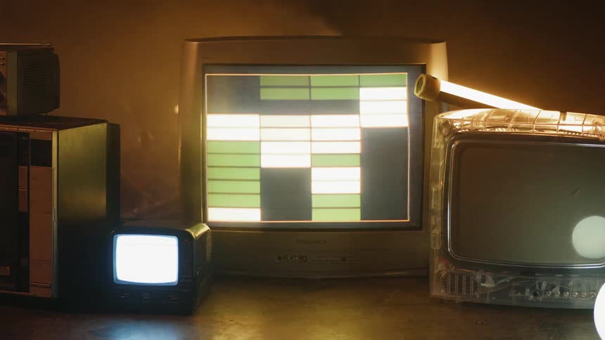 Patterns are flashing on the televisions sitting on the ground