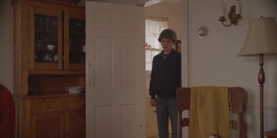 Child standing in the doorway and running past his mom