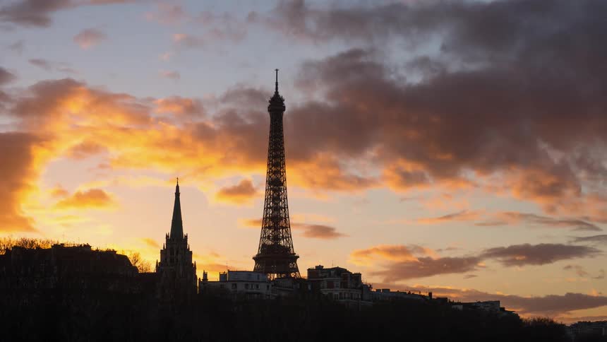 The clouds pass over the tower at dawn