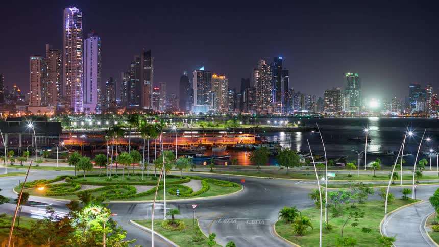 Traffic is flowing through a city at night