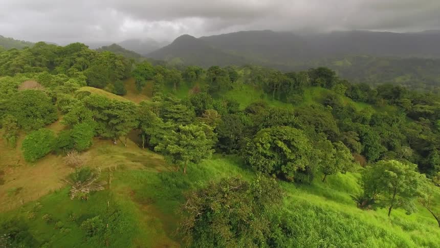 The mountains ahead are covered with storm clouds
