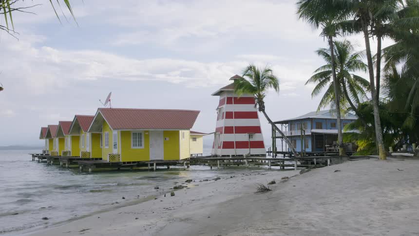 Colorful cabins are floating in a tropical beach resort in Panama