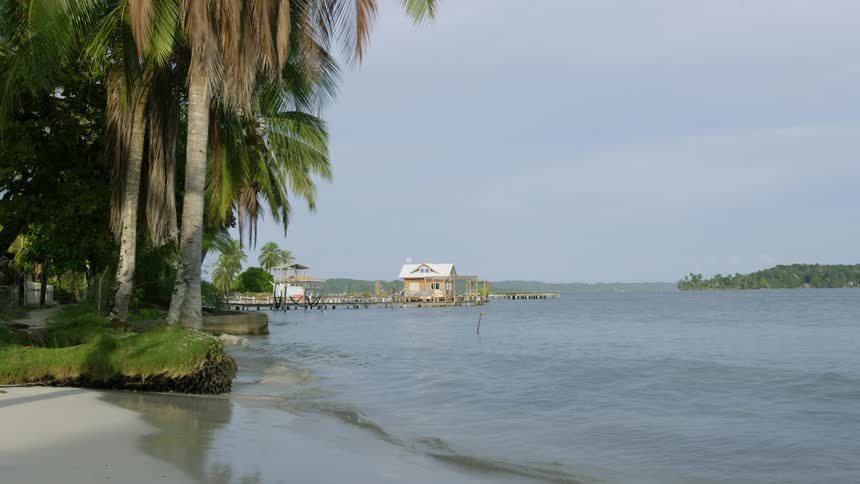 The water splashes against the Panamanian shore