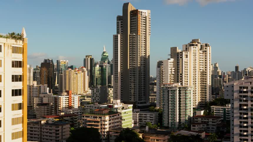 The city has many tall buildings on a windy day