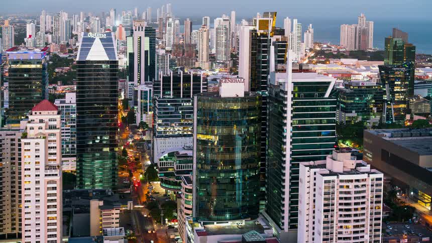 The city is packed with many buildings and vehicles driving