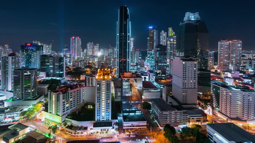 City lights from traffic and skyscrapers glows at night