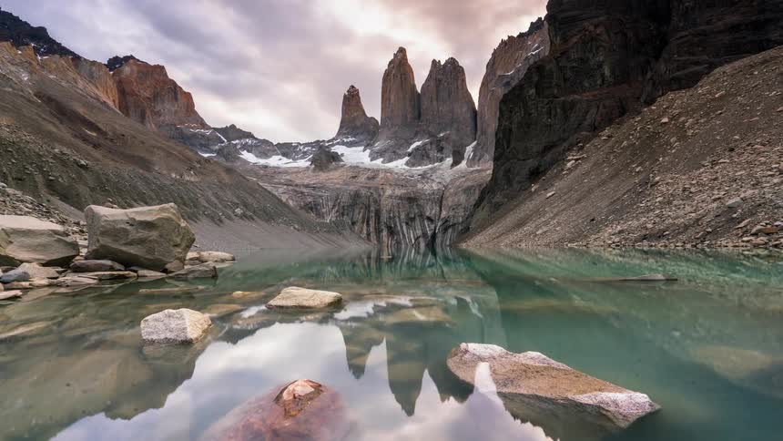 The water is calm on the mountain