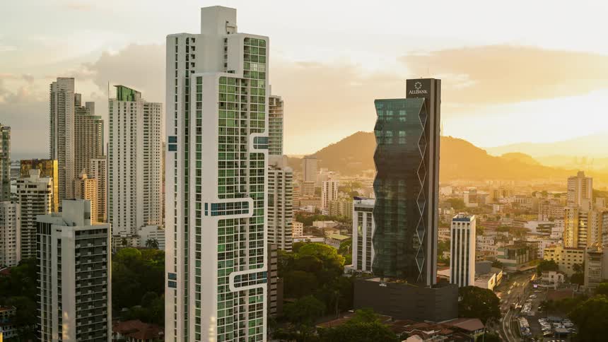 Traffic is flowing through a city at dawn