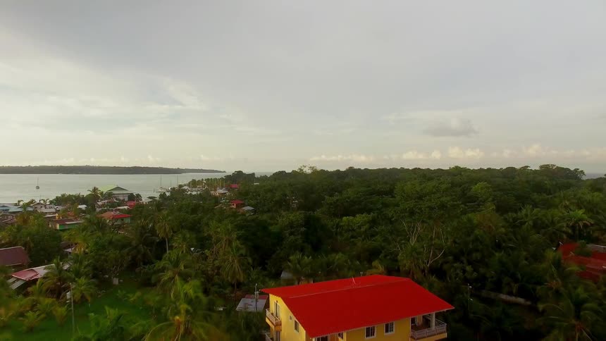 Yellow and red houses occupy the shore in this Panamanian resort town