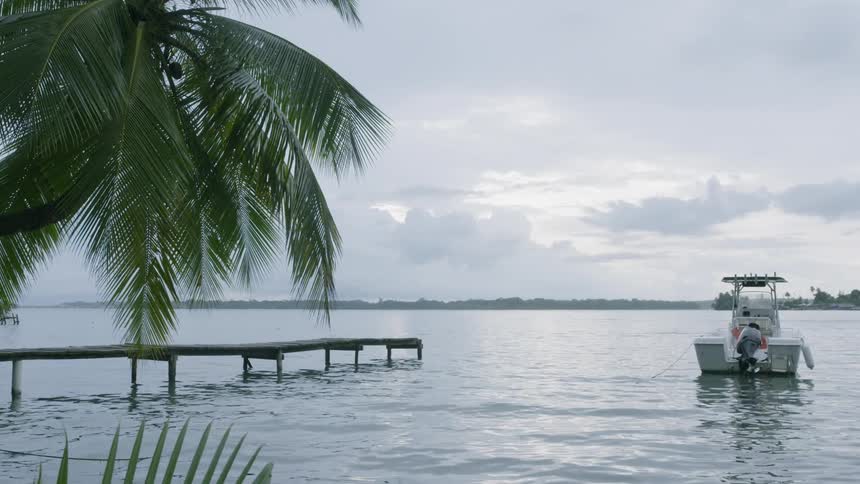 A boat is docked by the pier in Bocas del Toro