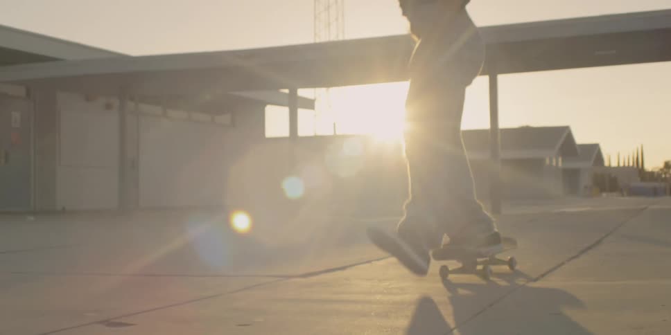 A man does a high jump on his skateboard