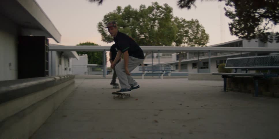 People ride their skateboards jumping and grinding on railings