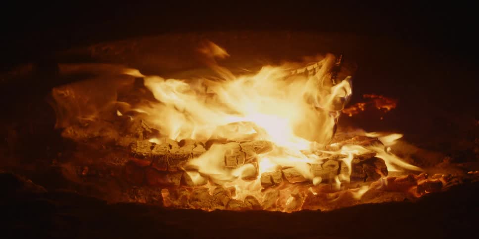 The pit is burning on a windy night