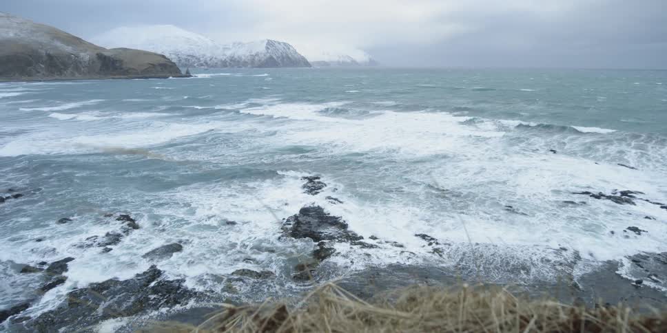 Waves crash onto the rocky coast