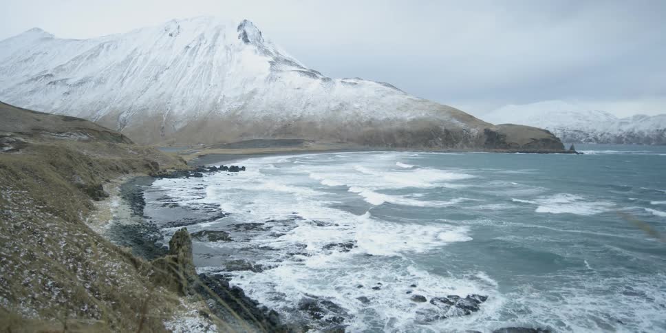 Waves crash onto the rocky shore