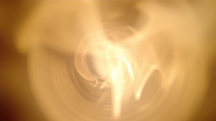 An abstract video of fire traveling through a small pipe