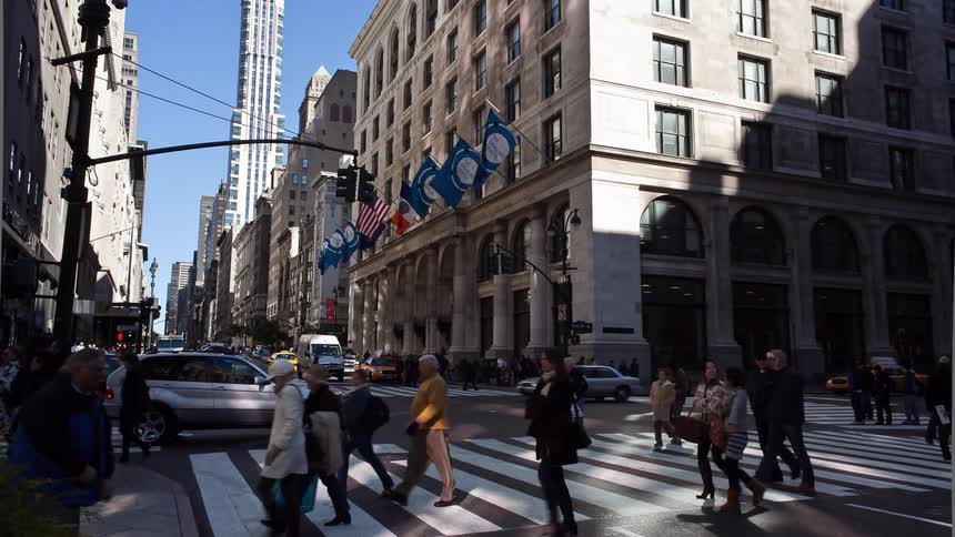 Vehicles and pedestrians commute in the city