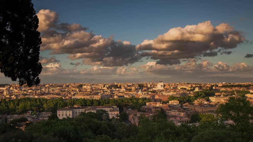 Clouds pass above a large city