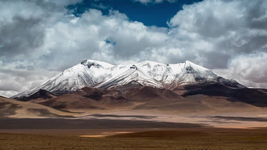 The top of the mountain is covered with snow ahead