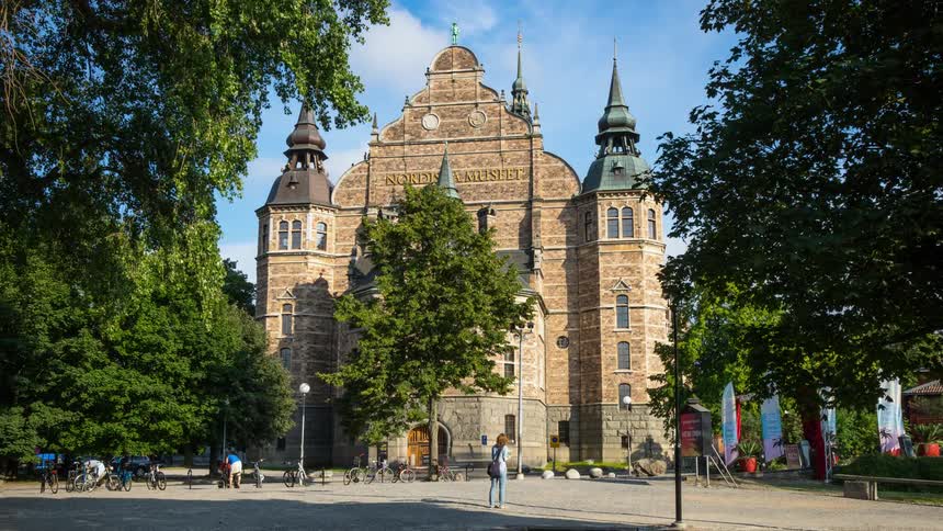 Pedestrians walk near an ancient church