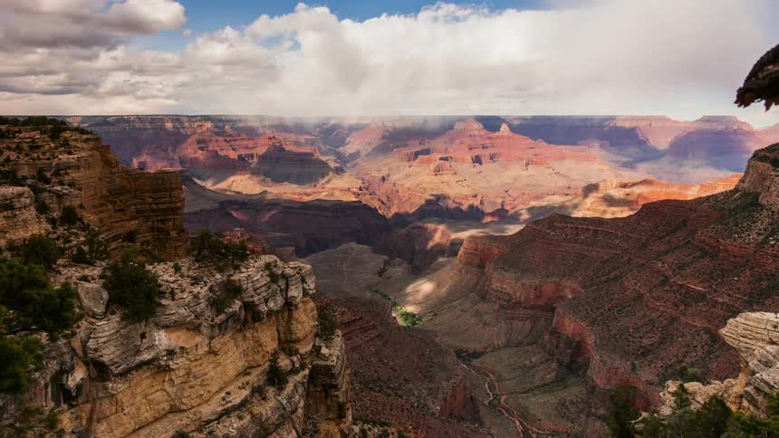 Clouds float over a canyon