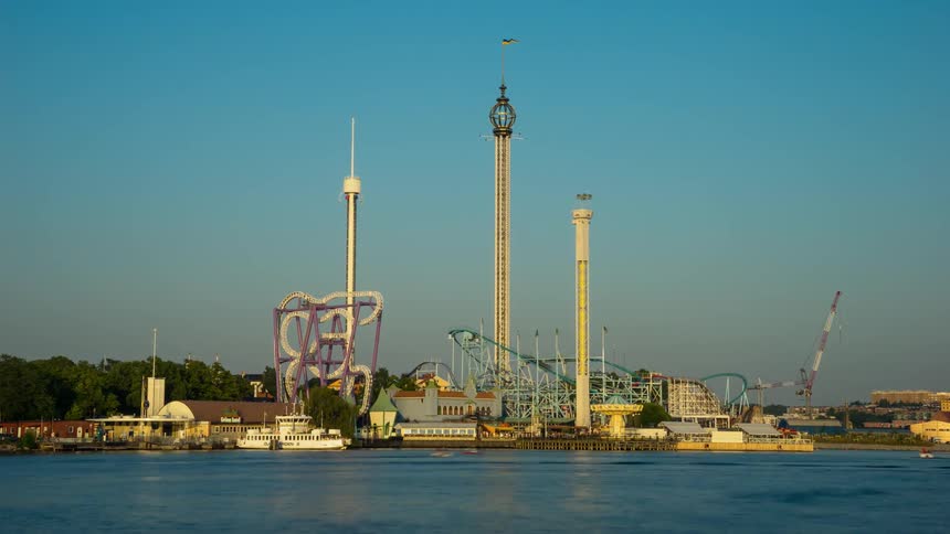 Amusement park rides spin and carry people