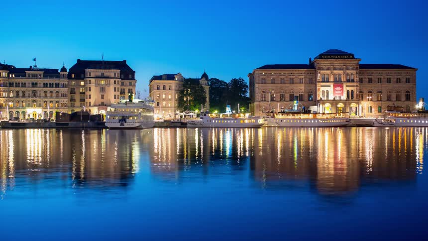 City port by a river at night