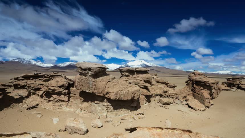 Clouds pass over a rocky canyon