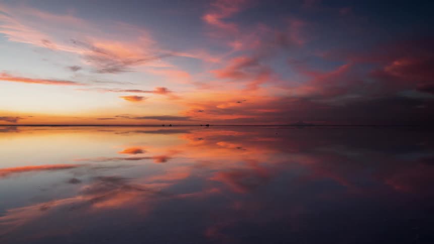 Still body of water at sunset
