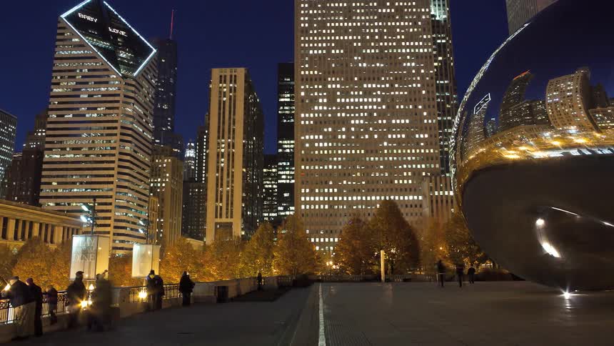 People moving through a city at night