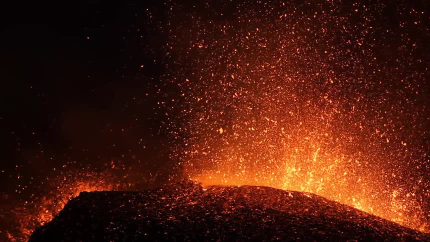 The lava is shooting in the night sky