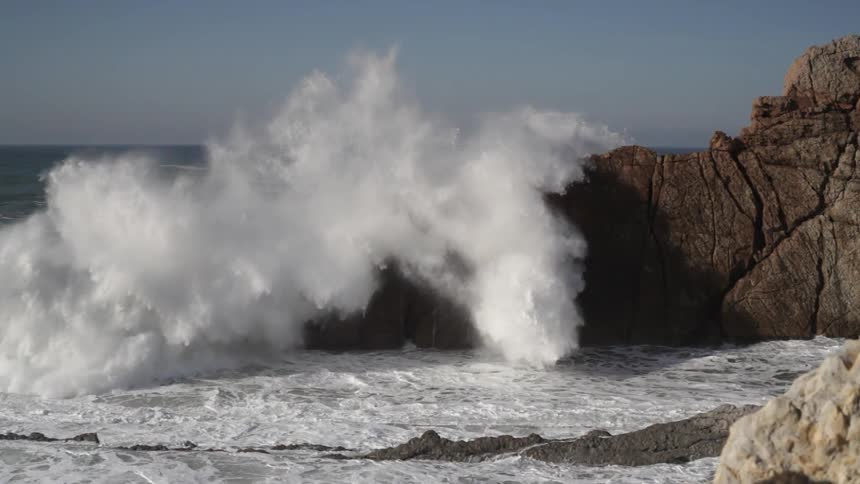 Waves rolling onto a rocky shore
