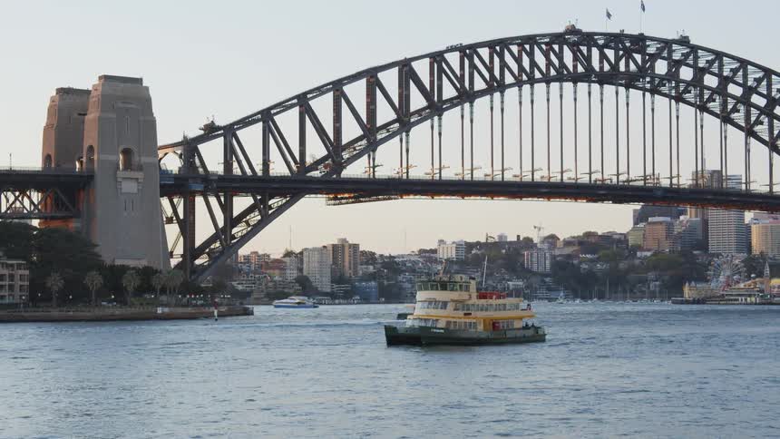 Boats float on a city river
