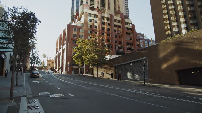 People and traffic moving in a city on a clear day