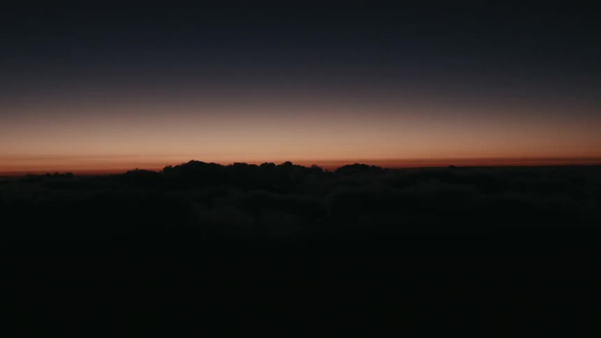 Time-lapse of a sunrise near the tops of clouds