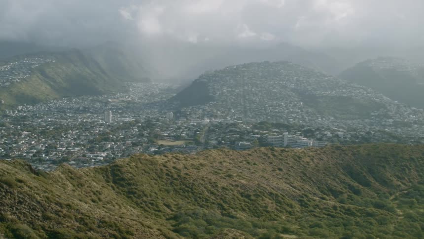 City sitting in a valley on a cloudy day