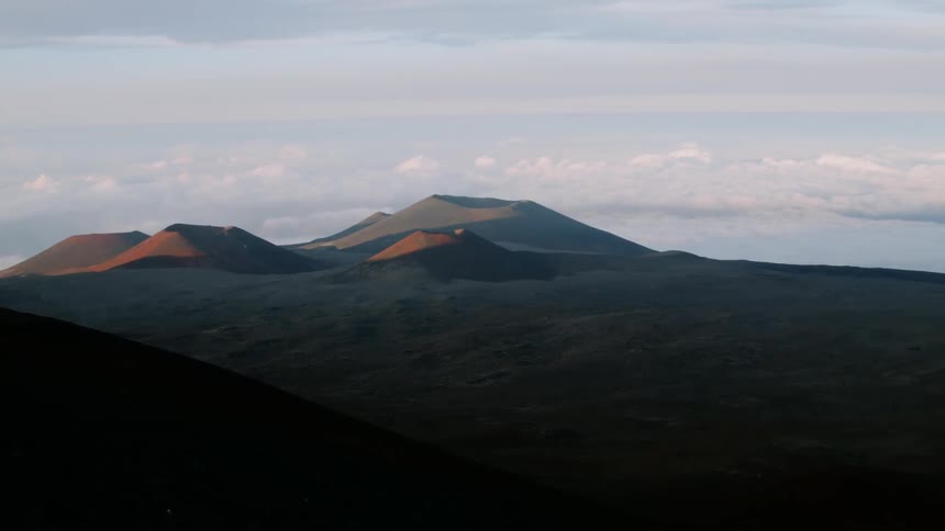 Clouds hang motionless over the hilly landscape
