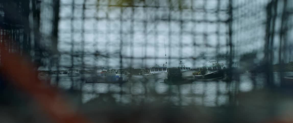 Boats rock on the water as they are docked