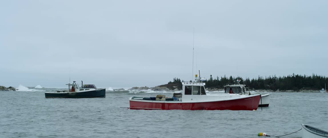 Boats rocking and floating on a body of water