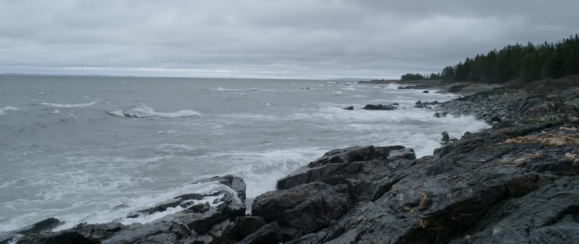 Ocean waves splashing onto a rocky shore