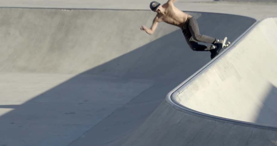 Man skateboarding doing jumps in a skate park