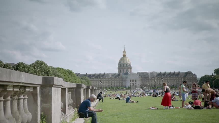 Large crowd of people in a park on a sunny day