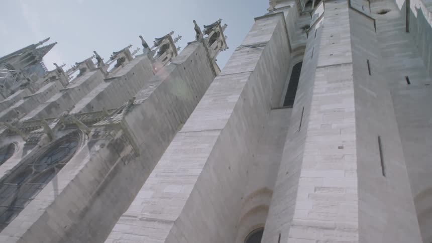 An old concrete church as viewed from street level