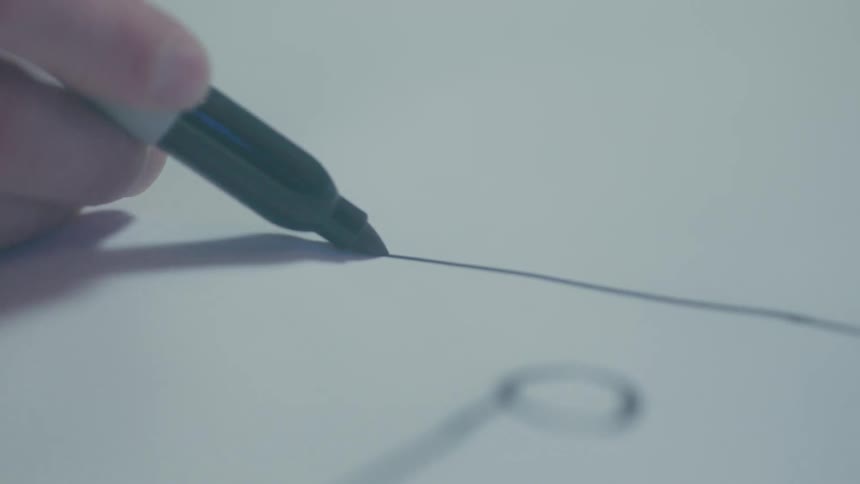 A person draws with a sharpie